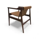 Vintage wooden lounge chair with leather cushion for modern living room decor.