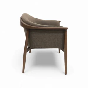 Comfortable modern armchair with wooden frame and plush fabric upholstery for stylish living spaces.