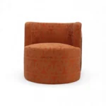 Luxurious orange velvet armchair with intricate fabric pattern, perfect for stylish home decor.