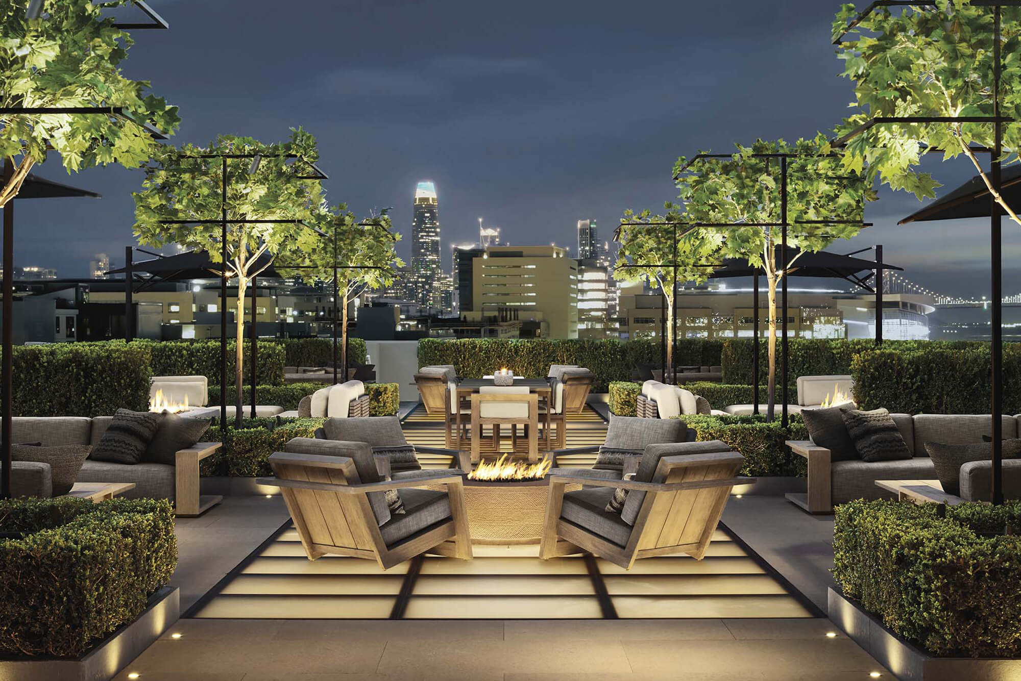 Residential rooftop terrace with walkable glass skylights and outdoor seating