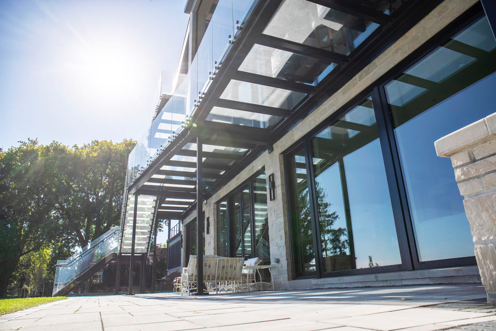 Covered exterior walkway with walkable glass floor panels