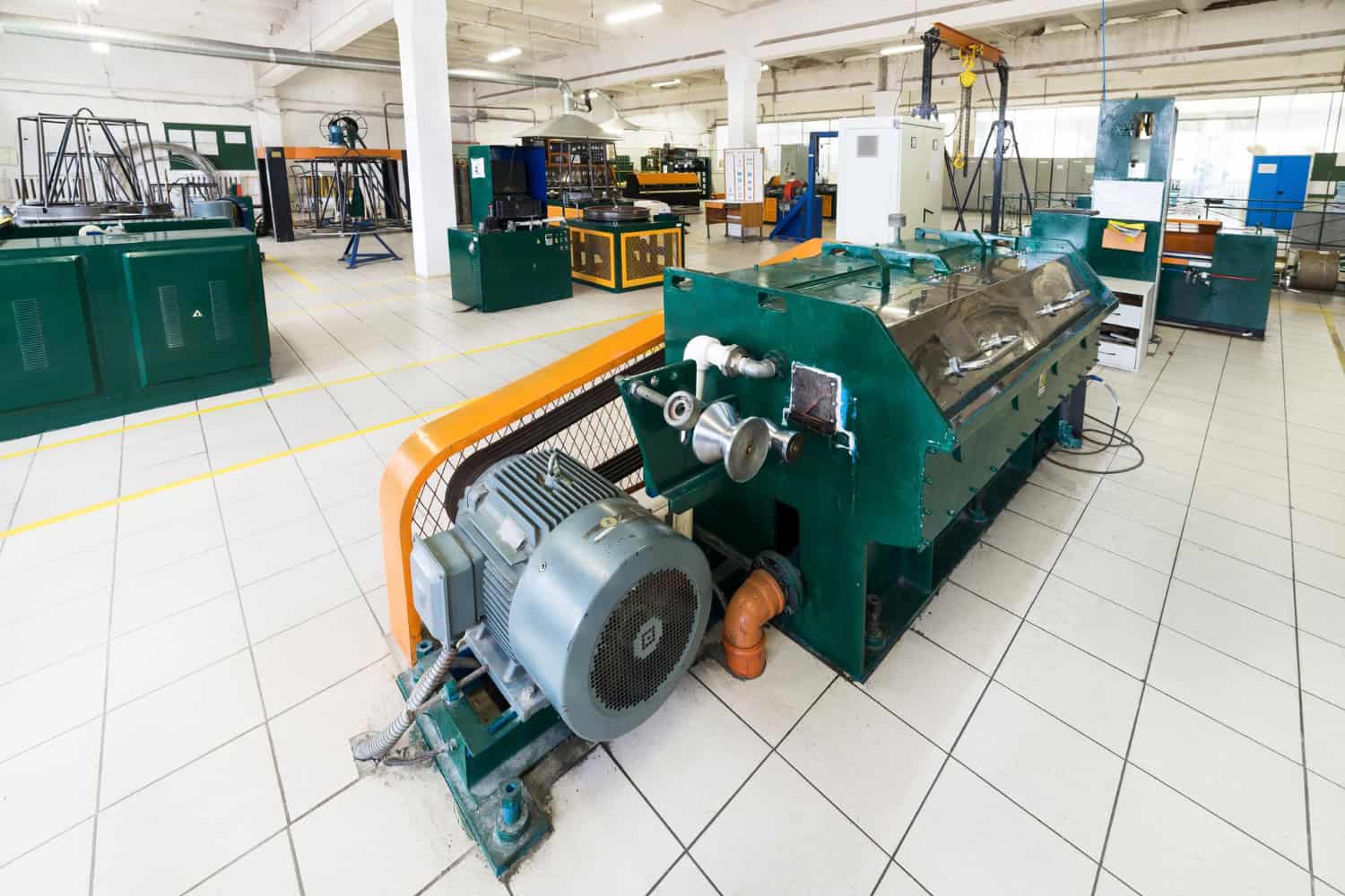 Large industrial manufacturing machinery in a factory setting.