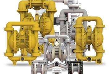 Industrial pumping system with yellow and gray pumps and pipes for fluid transfer.