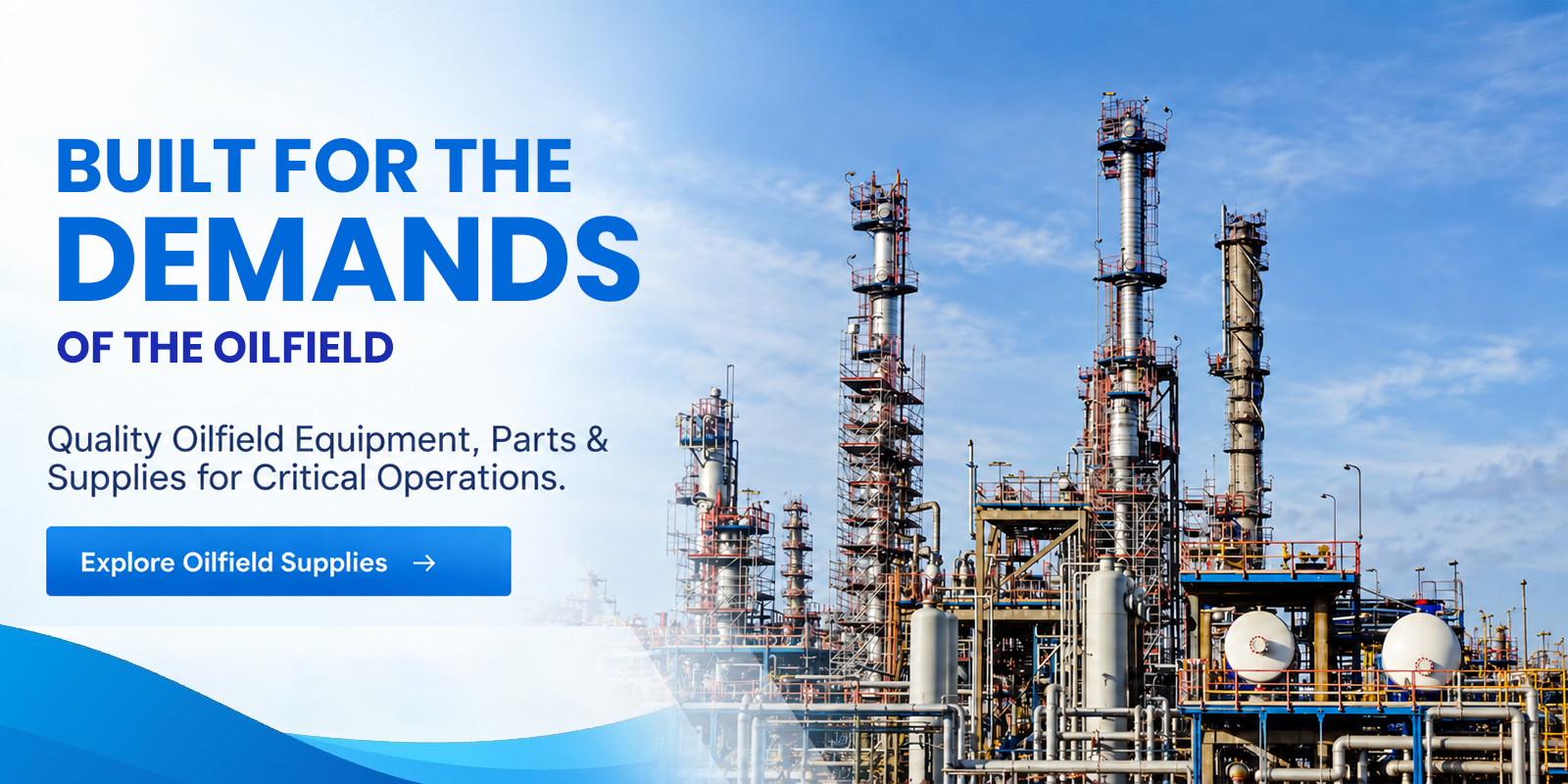 Oil refinery with tall distillation columns and industrial equipment under blue sky.