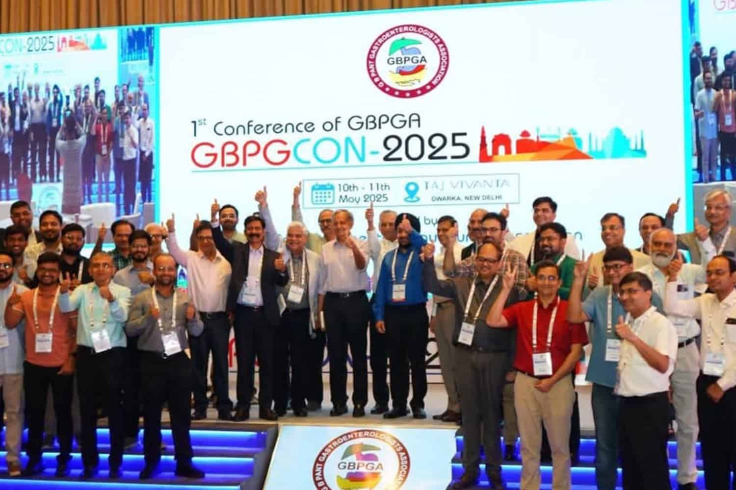 Group of conference attendees on stage at GBPGCON 2025 event.