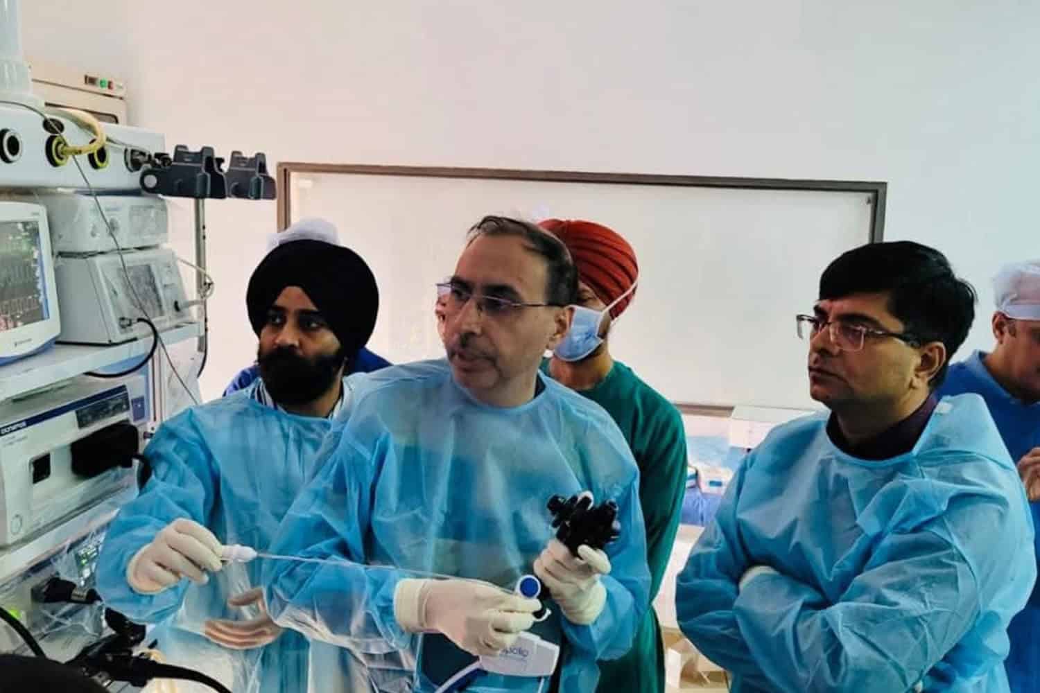 Surgeon Dr. Rajiv Grover leading a medical team during a surgical procedure.