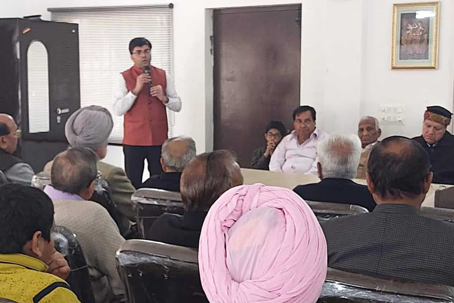 Dr. Rajiv Grover speaking at a medical seminar or conference.