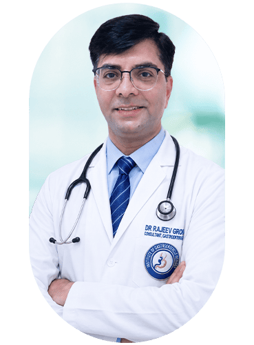 Gastroenterologist Dr. Rajeev Grover in white coat with stethoscope.