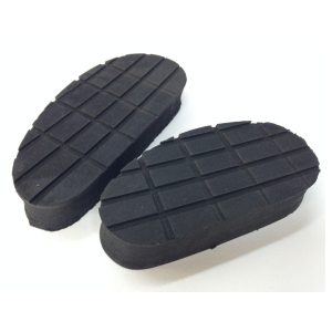 Black shoe soles with grooves, side by side.