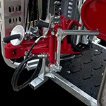 Red agricultural machinery with metal components.
