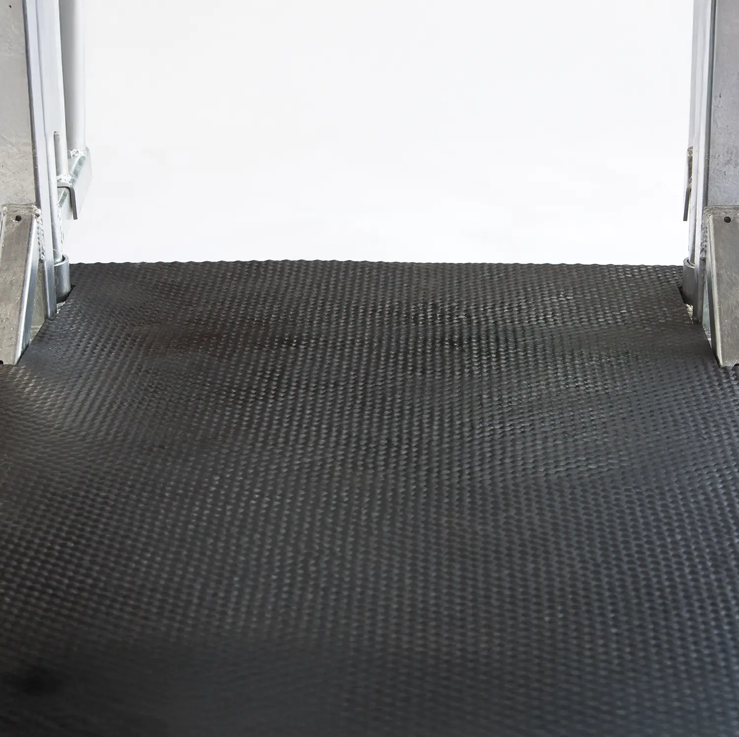Black textured rubber mat by doorway