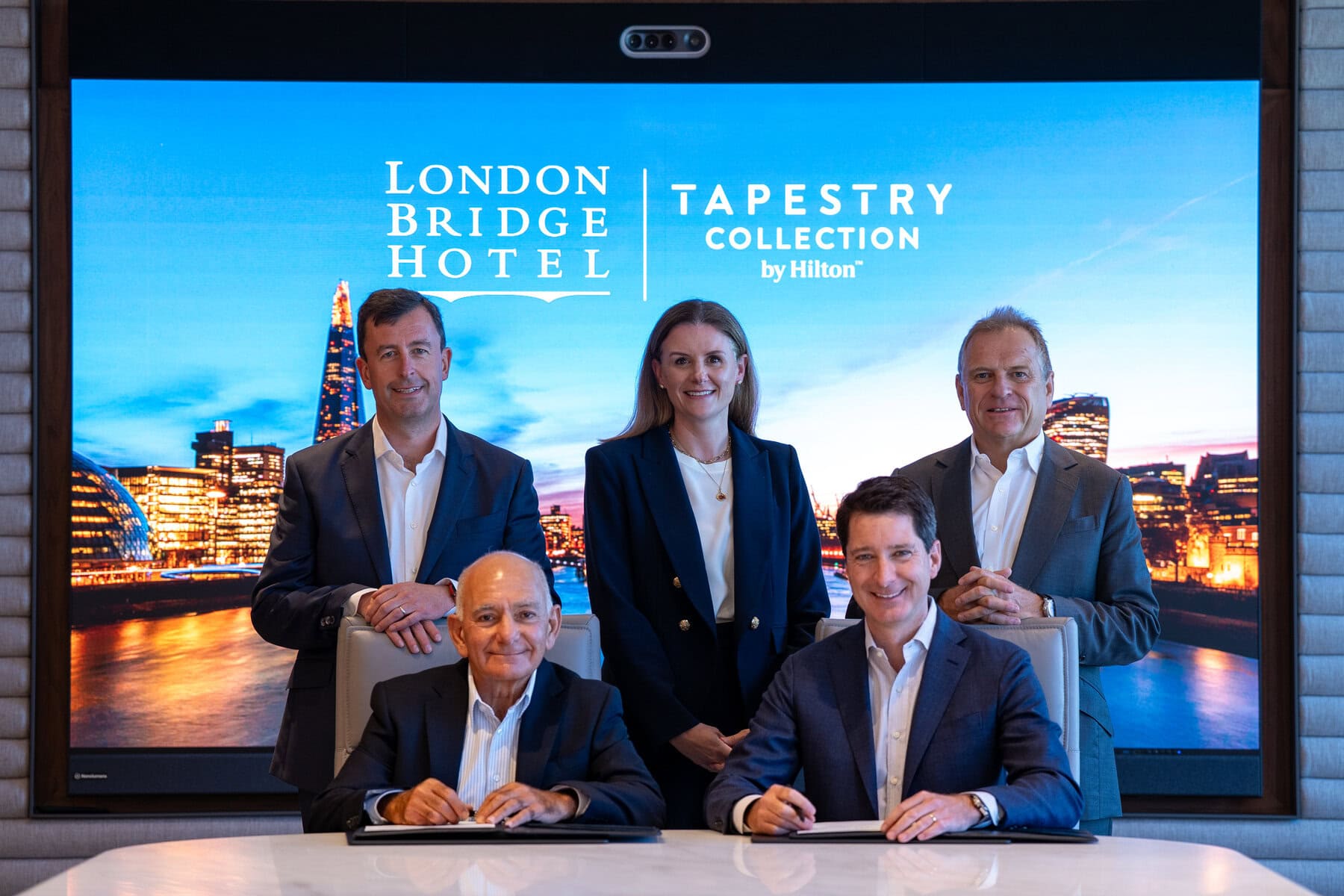 Hilton and Gama Holdings executives at the signing of London Bridge Hotel, Tapestry Collection by Hilton
