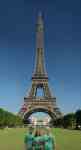 picture of family in front of the Eiffel Tower