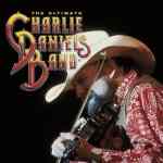 Charlie Daniels playing a fiddle man playing a fiddle