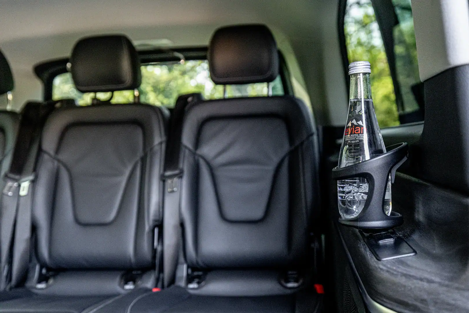 Mercedes V-Class cabin with black leather seats and refreshments for Budapest airport transfers