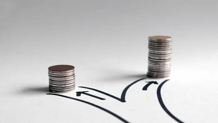 I3solutions logo with stacked coins representing financial growth.
