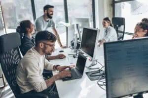 Remote and on-site teams collaborating on Microsoft-centric enterprise projects.
