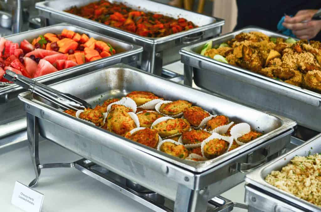 Office Buffet consisting of various cuisines served in silver trays by idocatering 2