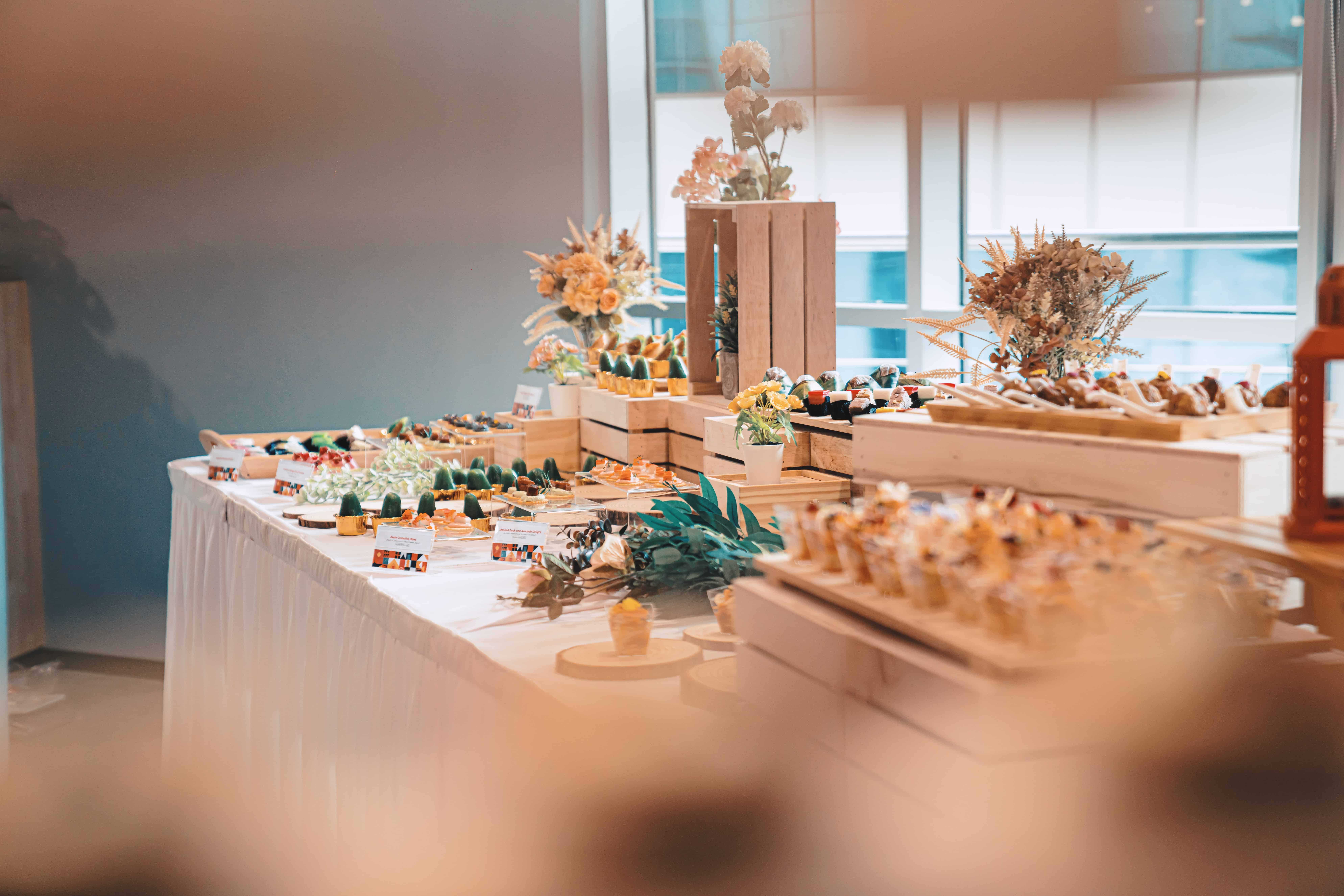 iDoCatering event banner featuring canapé desserts.