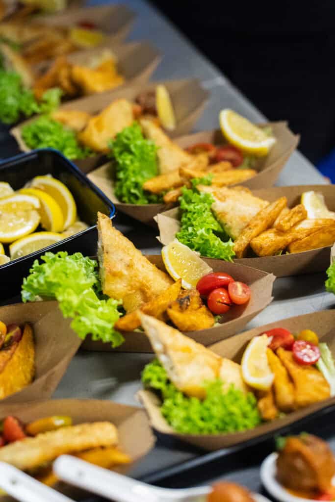 Creative Fish N Chip in Boat with small umbrella deco served during catering event