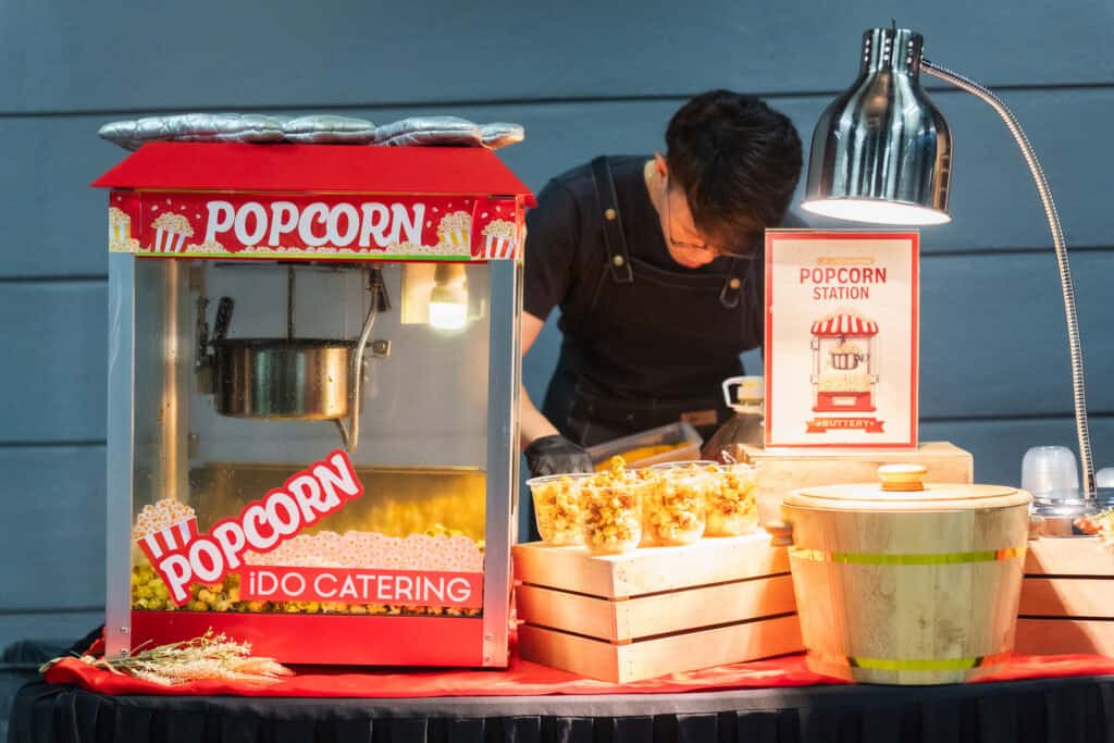 Catering event red popcorn making station 