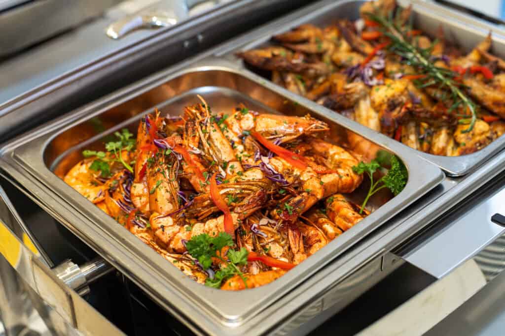Big shrimp catering served on tray by iDoCatering for a wedding