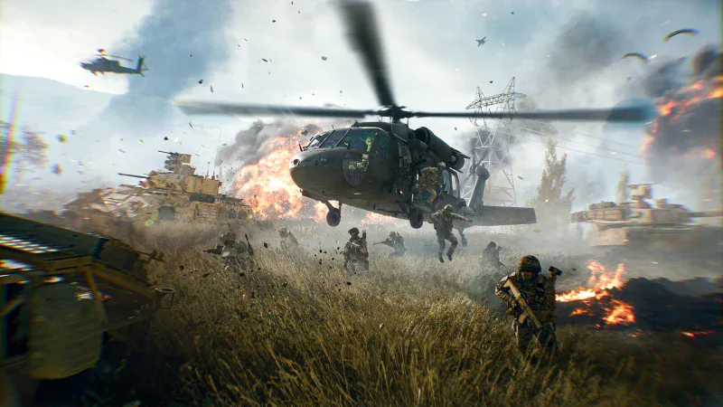 A Black Hawk lands troops in a burning field in Battlefield 6
