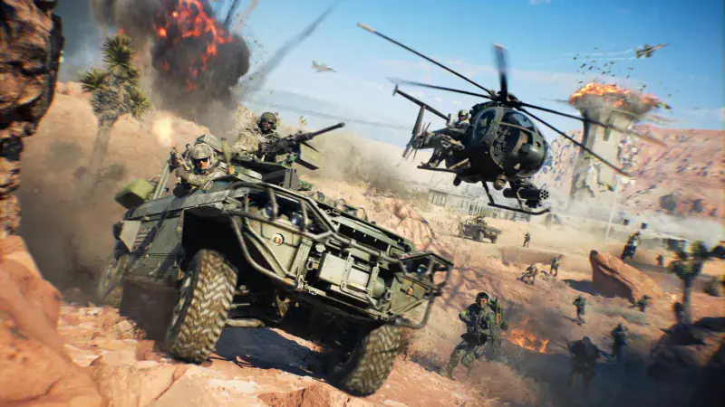 An armoured vehicle and attack helicopter fight through a burning desert base in Battlefield 6
