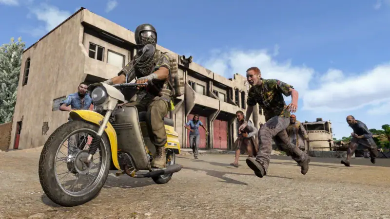 A survivor on a yellow moped rides past infected in a desert town in DayZ