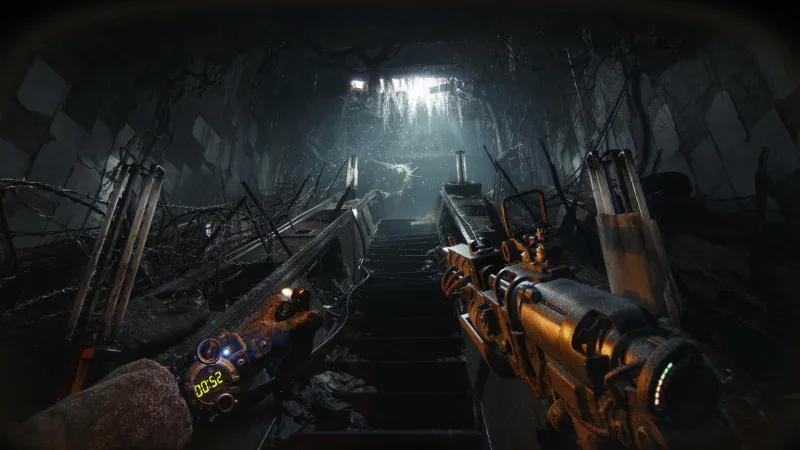 First-person view down a dark Metro tunnel with a weapon raised in METRO 2039