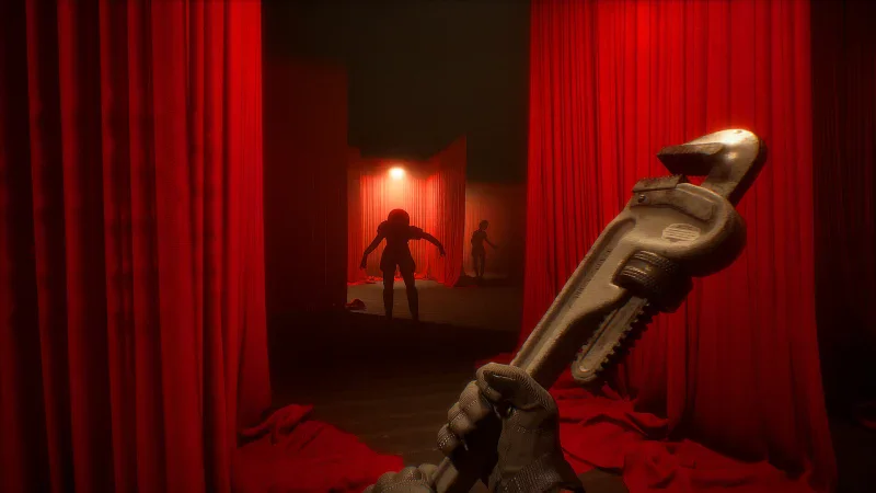 An operator with a wrench faces a figure in a room of red curtains in Phantom Line: Prologue