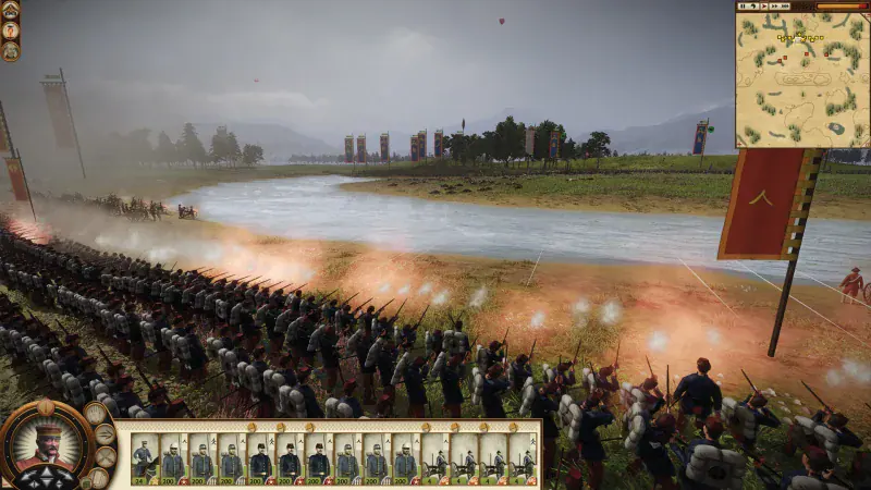 A line of riflemen fires across a river in the Fall of the Samurai campaign of Shogun 2 Complete Edition