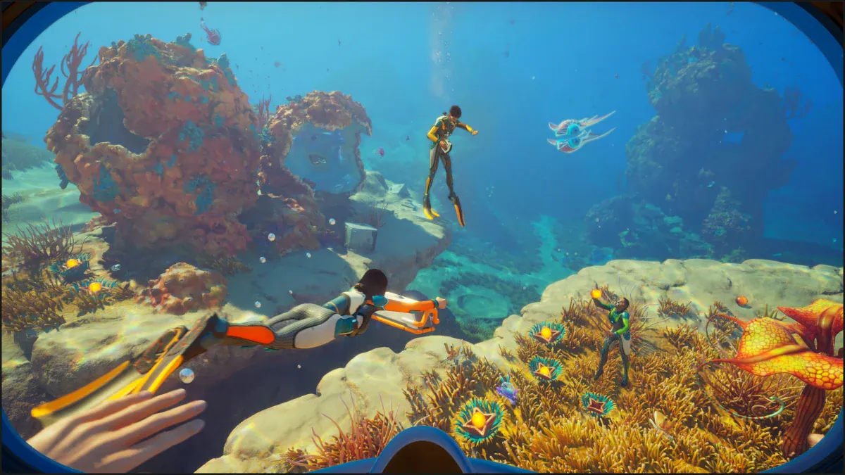 Two divers explore a sunlit coral reef together in Subnautica 2 co-op multiplayer