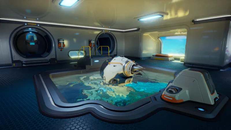 The Tadpole submersible docked in a base moonpool in Subnautica 2