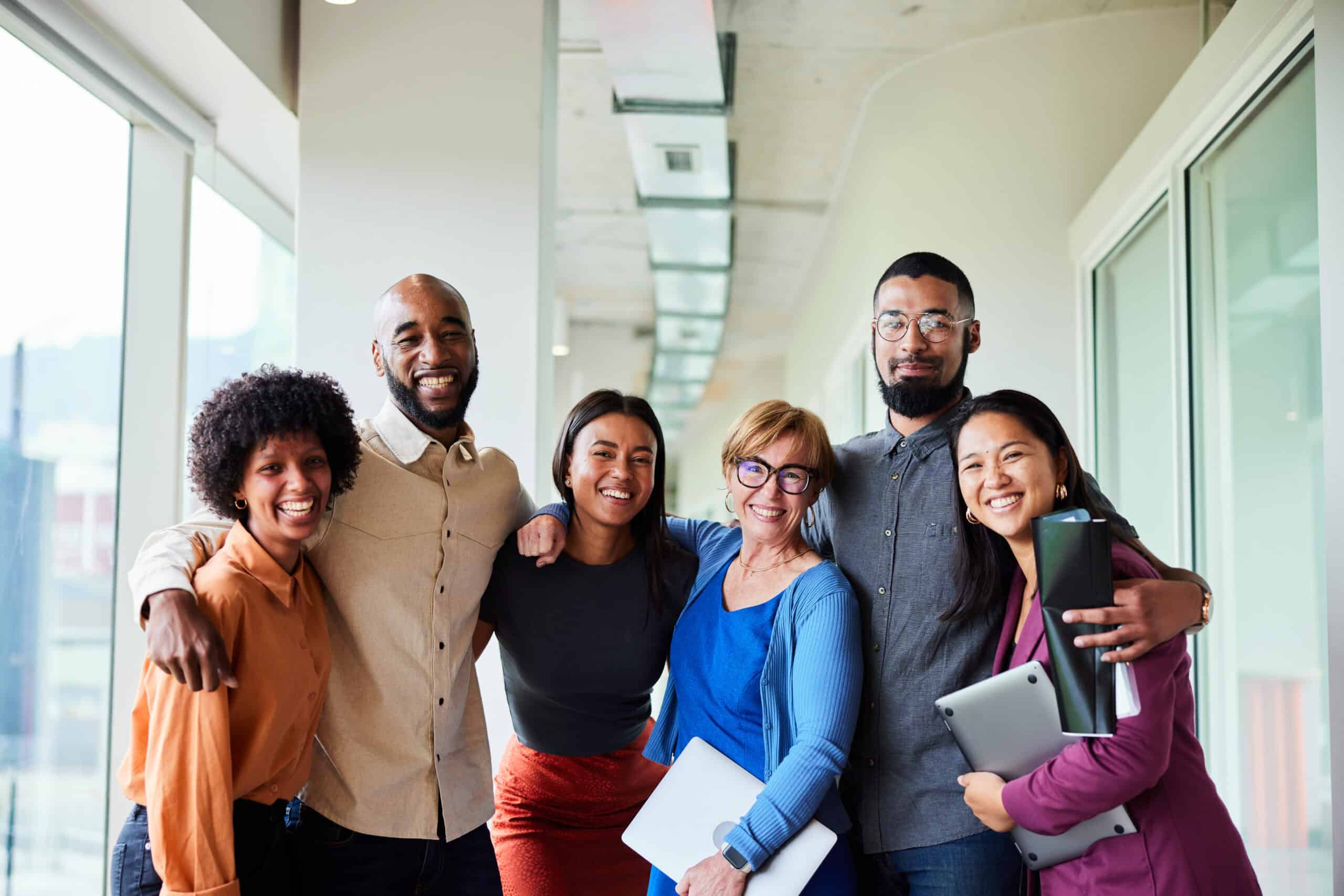 Empowered diverse team of professionals embracing independence, teamwork, and success.