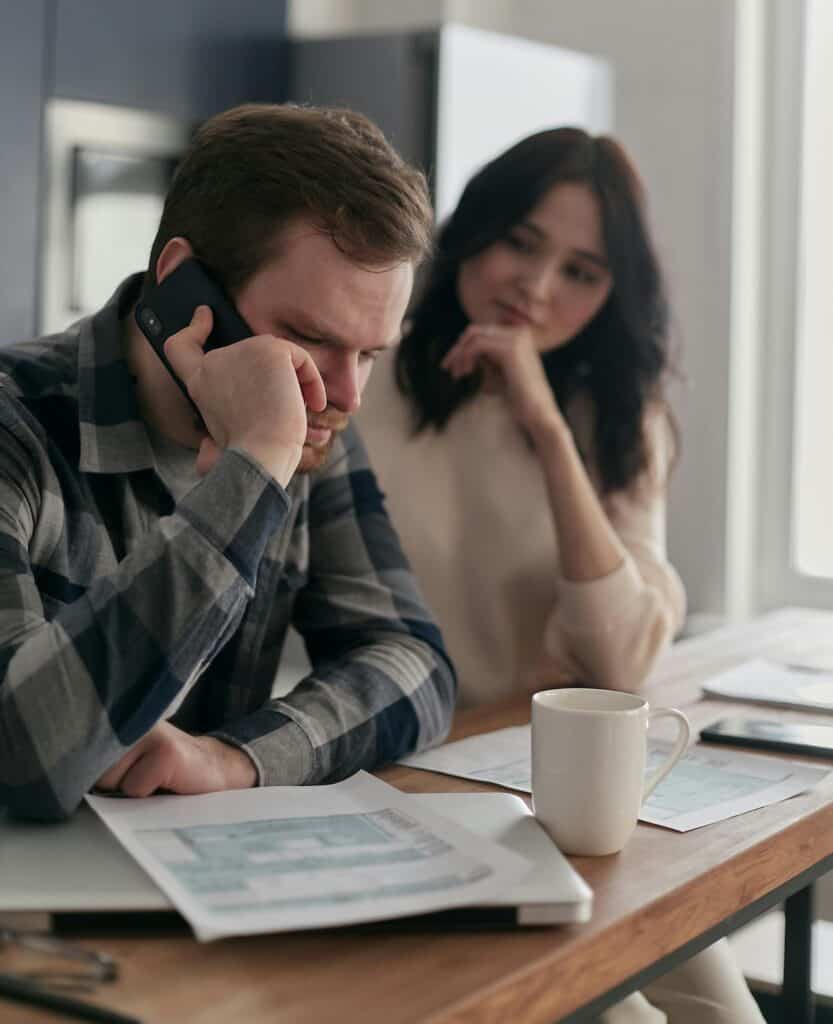 Person reaching out by phone, a simple way to connect with our autoimmune community.