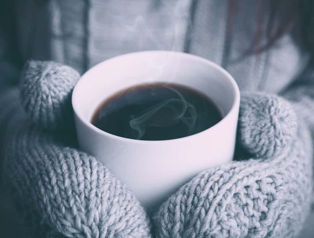 Warm mug and heat therapy used for autoimmune disease flare management and temperature-sensitive joint pain relief