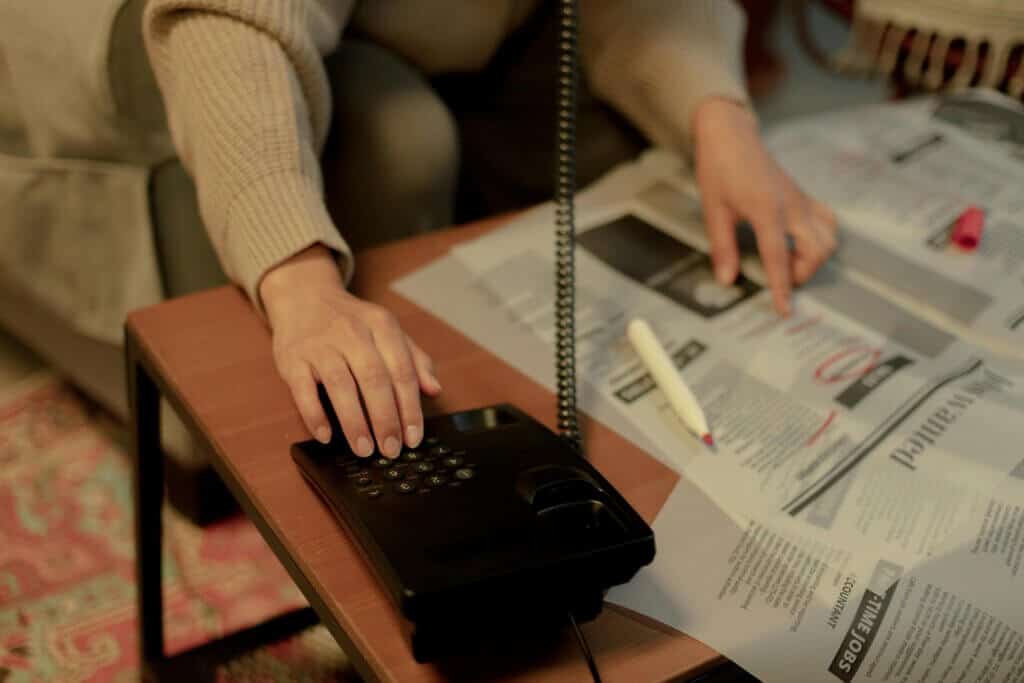 person dialling phone
