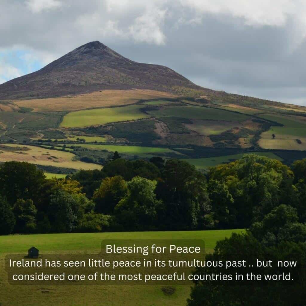 Green rolling hills and Slieve Donard mountain in Mourne Mountains, Northern Ireland.