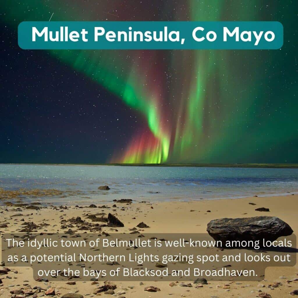 Northern Lights over Belmullet town in County Mayo, Ireland, with a starry night sky.
