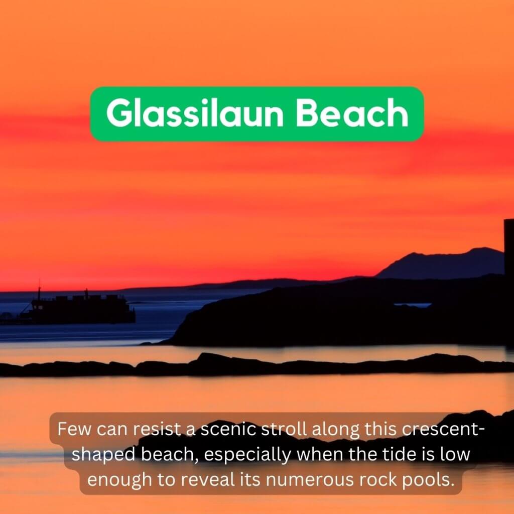 Scenic sunset over Glassilaun Beach with colorful sky and rocky silhouette.