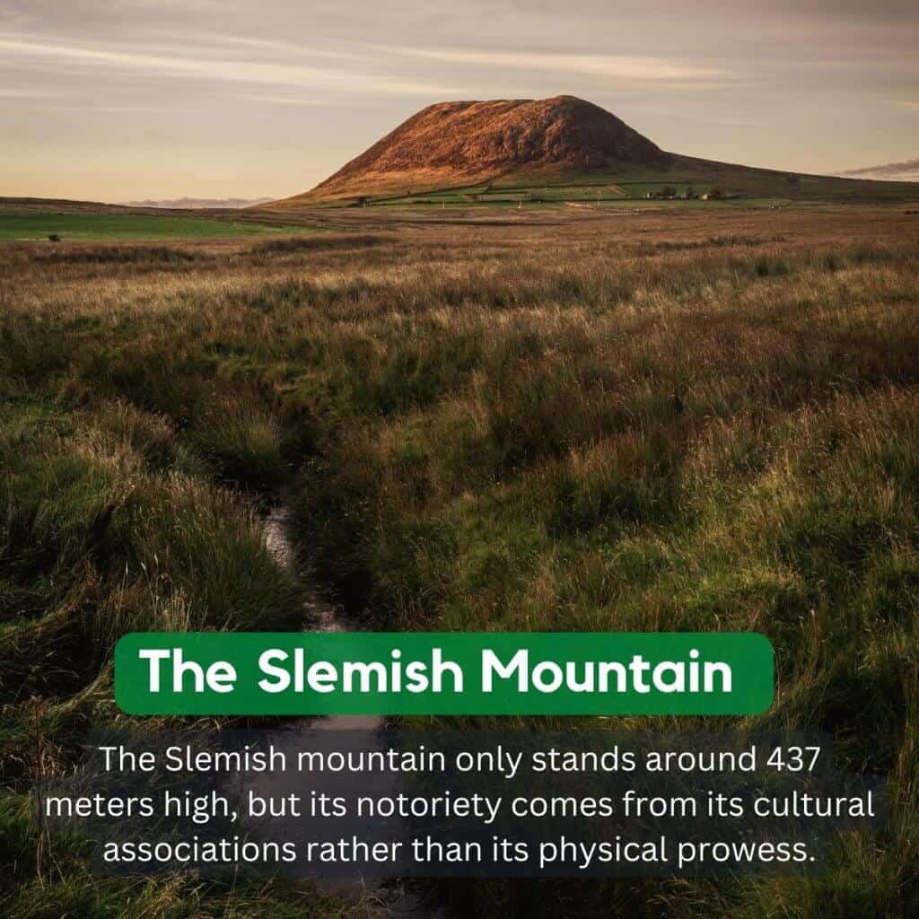 Slemish Mountain in Ireland during sunset, with lush green fields and a dirt path leading to the summit.