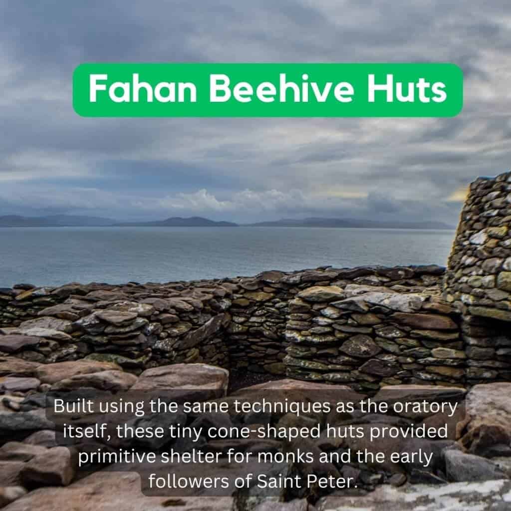 Fahan Beehive Huts overlooking the Irish Sea on a cloudy day, built using traditional techniques.