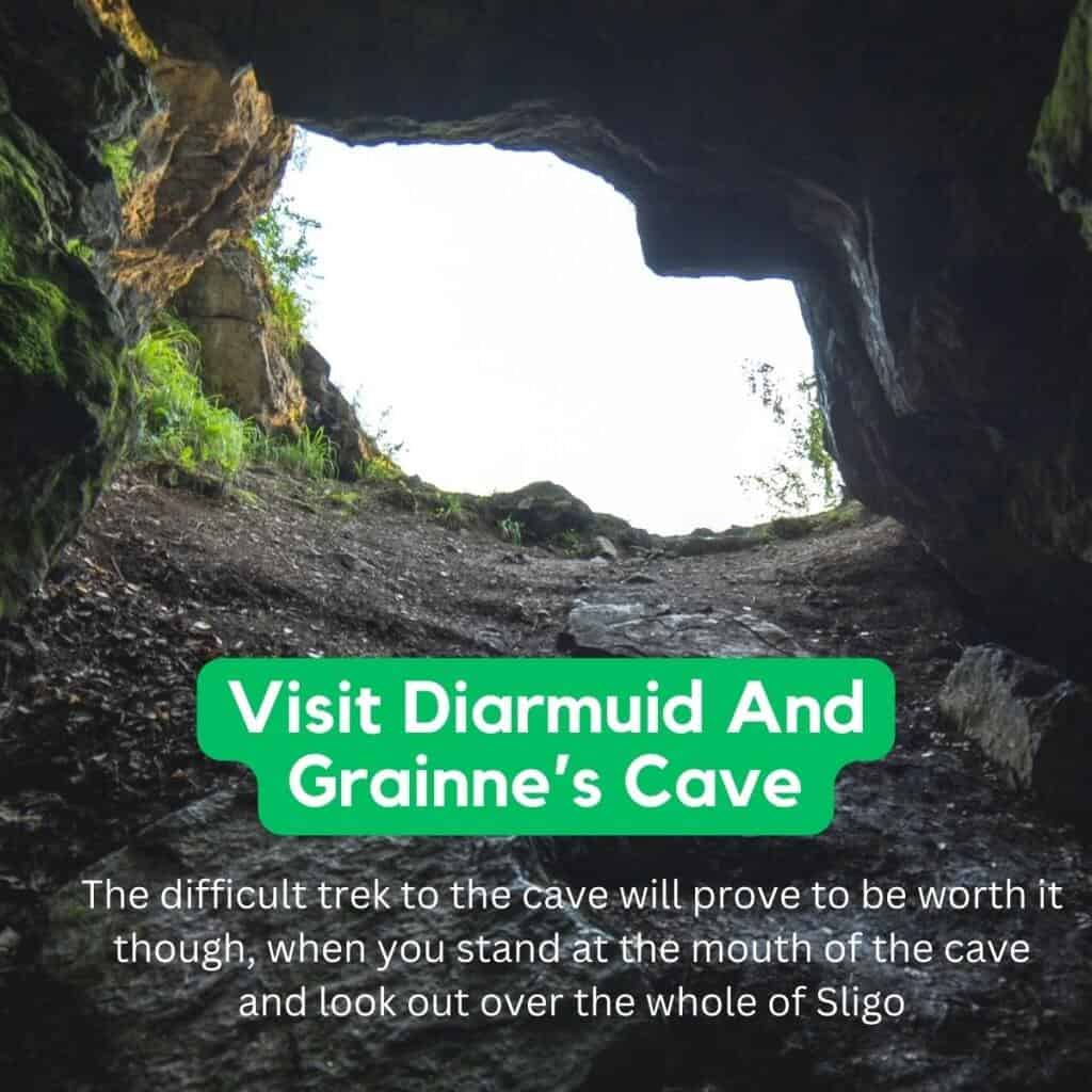 Dioruid and Grainne’s Cave in Sligo, Ireland, viewed from inside the cave opening with greenery around.