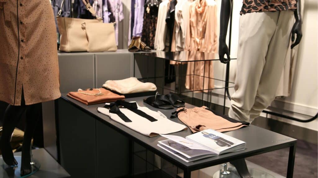 Elegant Irish fashion boutique displays with clothing and accessories.