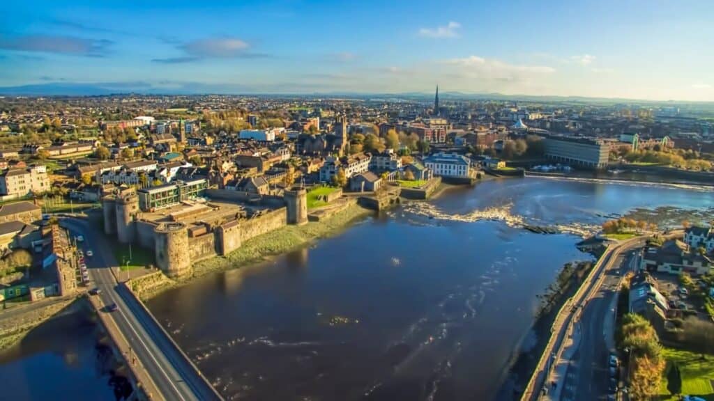 Stunning aerial view of Limerick city with Shannon River and historic architecture.
