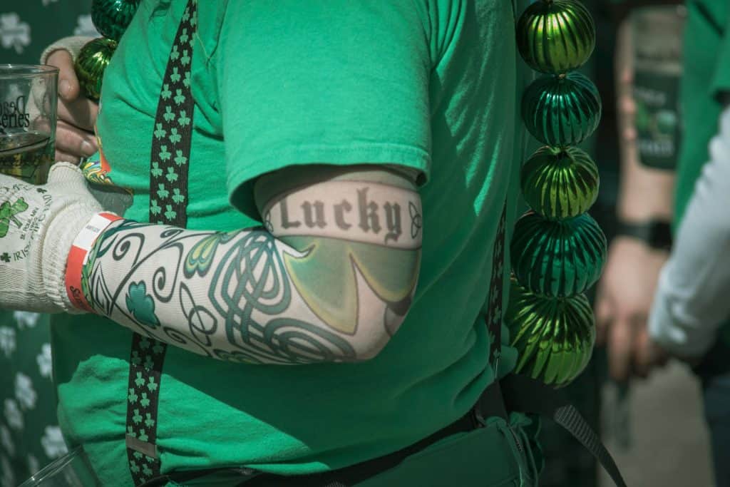 Green Irish attire and tattoos celebrating St. Patrick's Day festivities in Ireland.