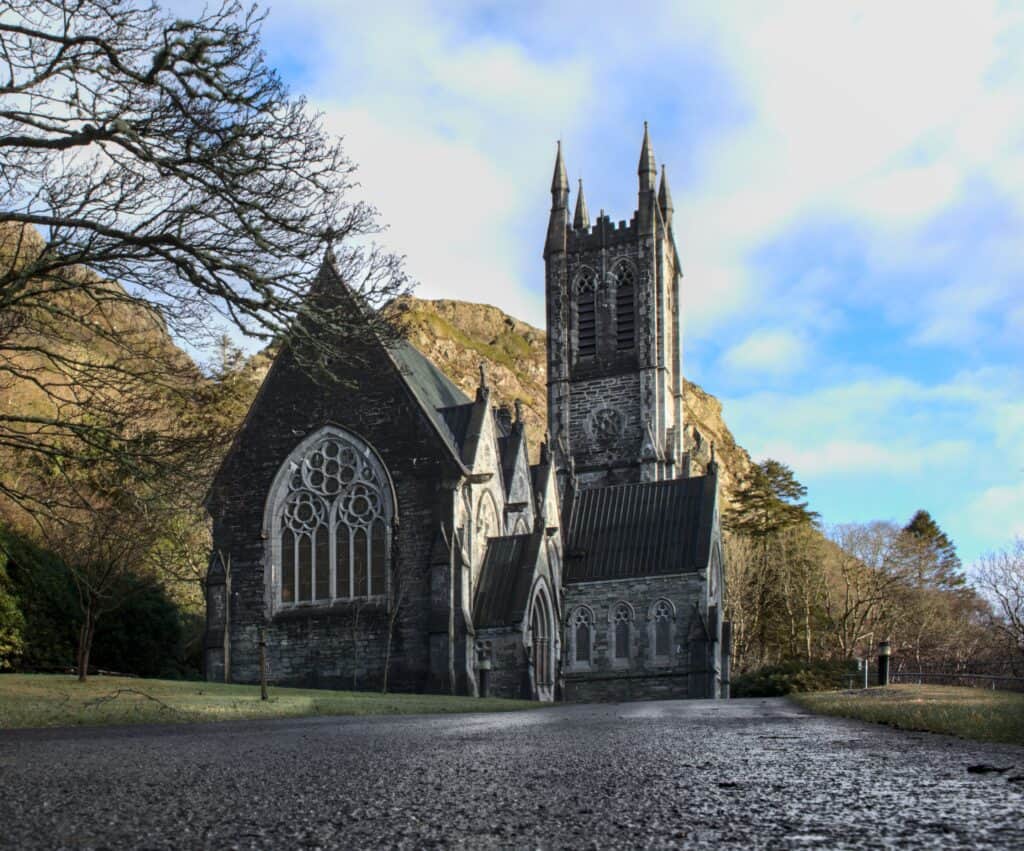 Stunning Gothic Revival architecture in a serene landscape, Letterfrack, Ireland.