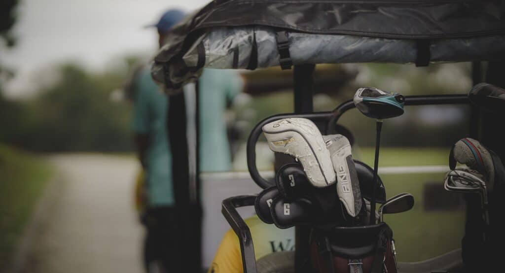 Golf clubs on a golf cart at an Irish golf course.