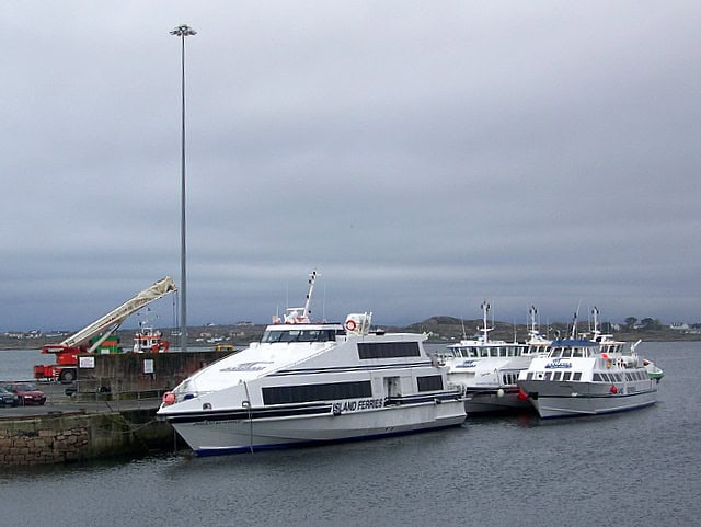 Ferry boats docked at Irish harbor in Ireland.